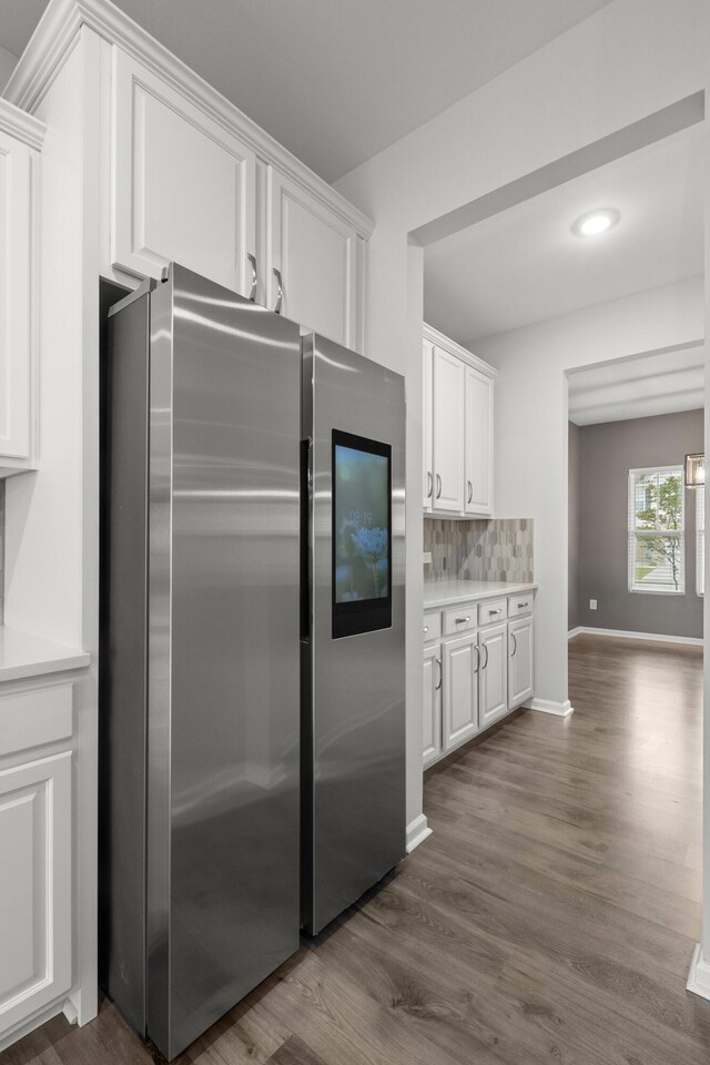 514 Purple Finch Rd, Summerville, SC 29486 - kitchen with freestanding refrigerator, white cabinetry, dark wood finished floors, backsplash, and light countertops