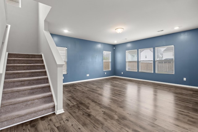 514 Purple Finch Rd, Summerville, SC 29486 - unfurnished living room with dark wood-style flooring, stairs, baseboards, and recessed lighting