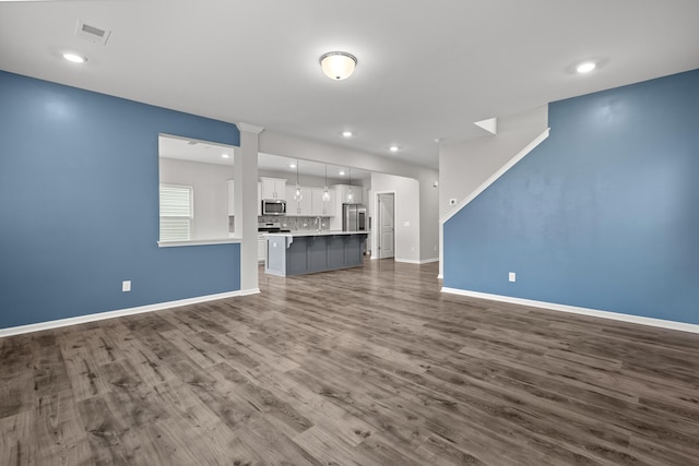 514 Purple Finch Rd, Summerville, SC 29486 - unfurnished living room featuring dark wood-style flooring, baseboards, and recessed lighting