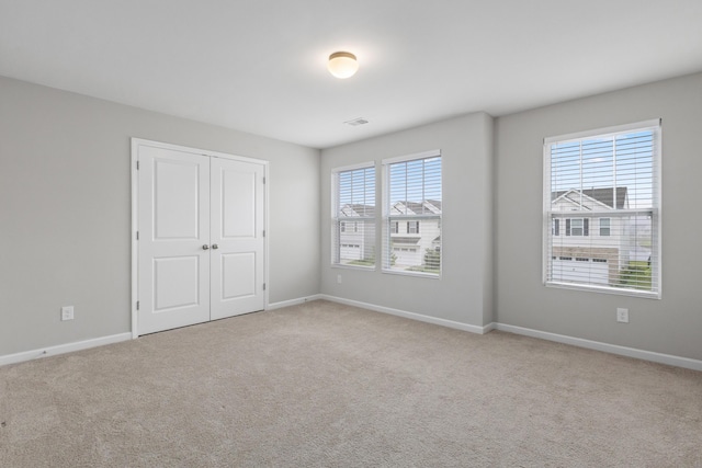514 Purple Finch Rd, Summerville, SC 29486 - unfurnished bedroom featuring multiple windows, carpet flooring, and baseboards