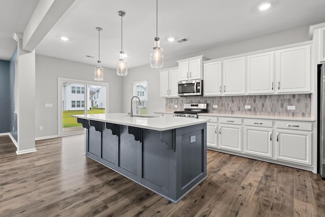 514 Purple Finch Rd, Summerville, SC 29486 - kitchen featuring stainless steel appliances, a sink, white cabinetry, decorative backsplash, and light countertops