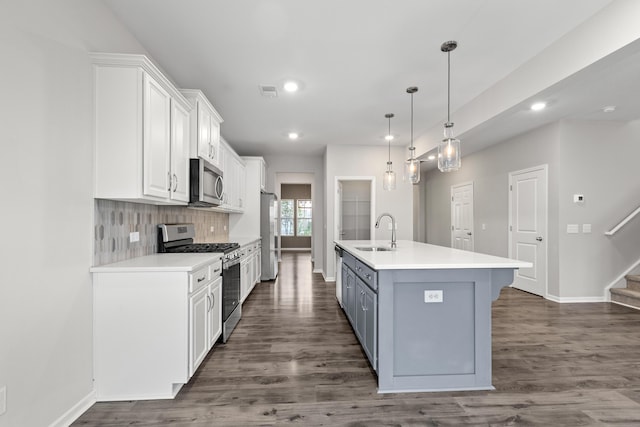 514 Purple Finch Rd, Summerville, SC 29486 - kitchen with appliances with stainless steel finishes, a sink, white cabinetry, recessed lighting, and a kitchen island with sink