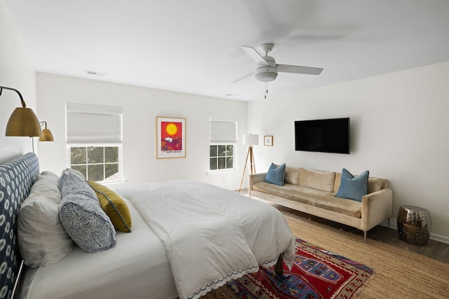 1825 Crossbill Trl, Hanahan, SC 29410 - bedroom with wood finished floors, multiple windows, a ceiling fan, and baseboards