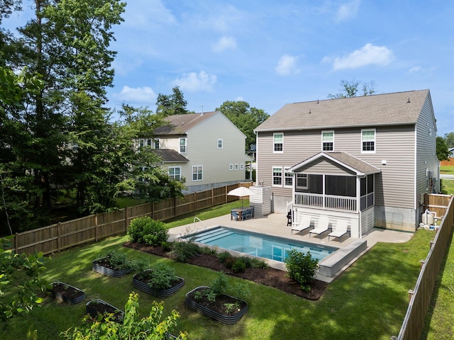 1825 Crossbill Trl, Hanahan, SC 29410 - rear view of property with a sunroom, a patio, roof with shingles, and a garden