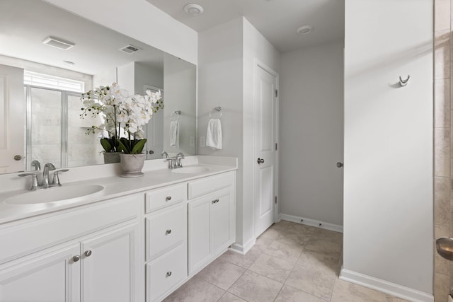1825 Crossbill Trl, Hanahan, SC 29410 - full bath with double vanity, tile patterned flooring, baseboards, and a tile shower