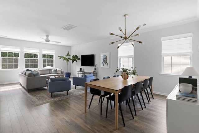 1825 Crossbill Trl, Hanahan, SC 29410 - dining space featuring a chandelier, dark wood finished floors, and plenty of natural light