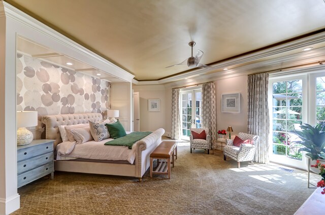 carpeted bedroom with access to outside, multiple windows, ceiling fan, and ornamental molding