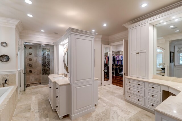 bathroom with plus walk in shower, french doors, vanity, crown molding, and tile flooring