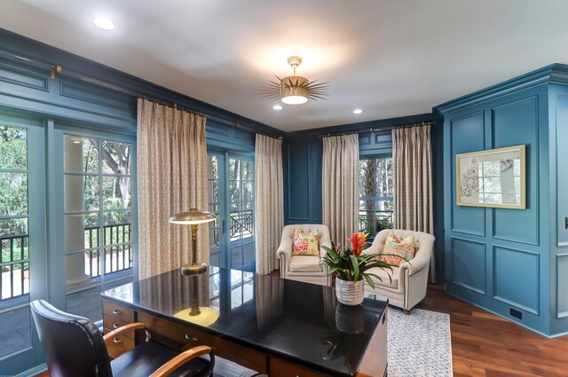 dining space featuring dark hardwood / wood-style flooring and a wealth of natural light