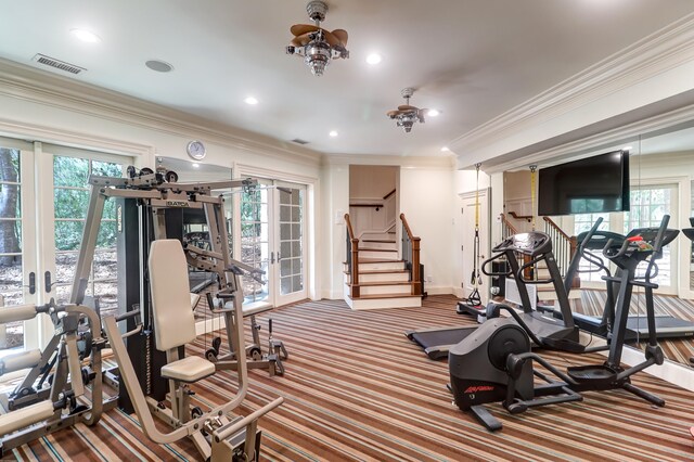 workout room featuring crown molding and french doors