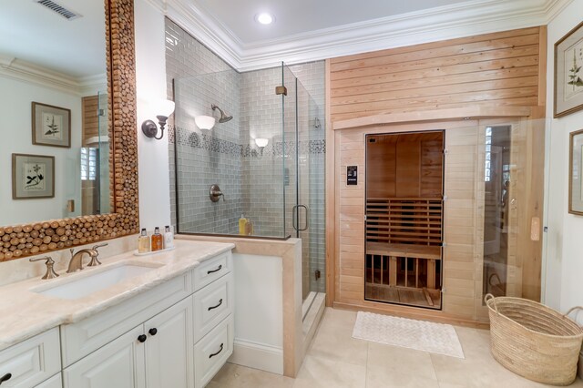 bathroom featuring an enclosed shower, vanity, tile floors, and ornamental molding