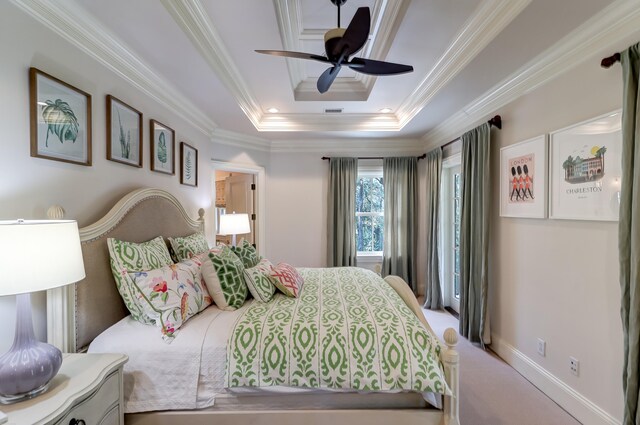 bedroom featuring crown molding, ceiling fan, a raised ceiling, and light carpet