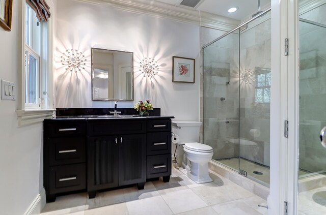 bathroom featuring walk in shower, tile flooring, toilet, large vanity, and ornamental molding