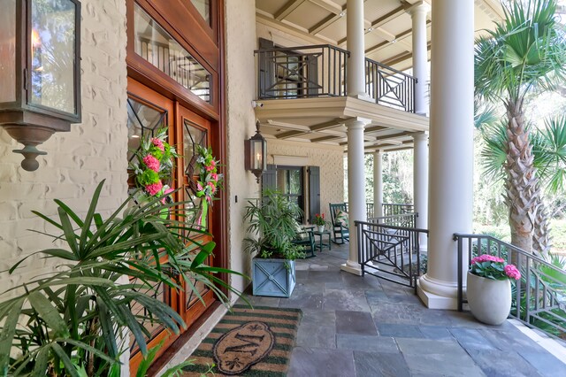 entrance to property featuring a balcony