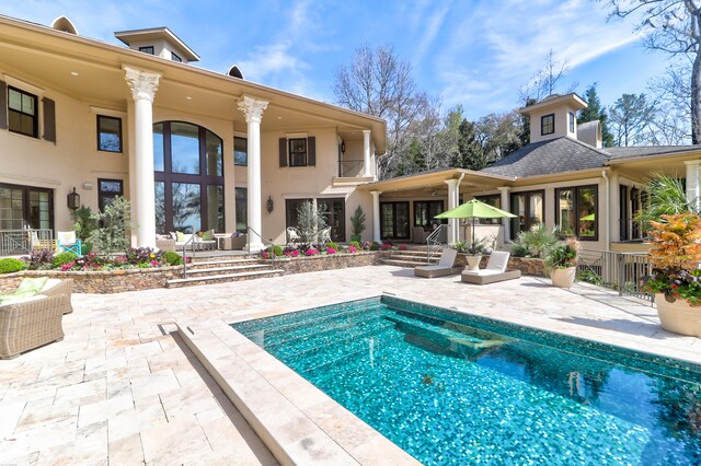 view of swimming pool with a patio