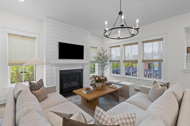 1828 Agate Bay Dr, Mount Pleasant, SC 29466 - living room featuring a chandelier, a large fireplace, and wood finished floors
