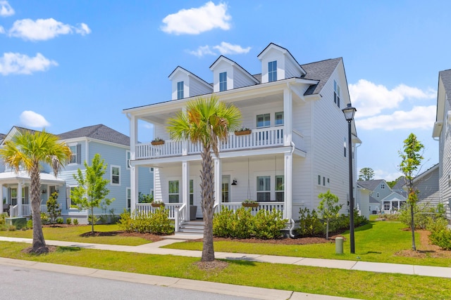1828 Agate Bay Dr, Mount Pleasant, SC 29466 - view of front of house with a porch, a balcony, and a front yard