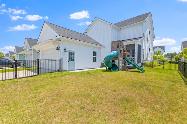 1828 Agate Bay Dr, Mount Pleasant, SC 29466 - rear view of property featuring a playground, an attached garage, and driveway
