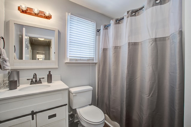 2916 Shadow Ln, North Charleston, SC 29406 - full bathroom with vanity, toilet, and a shower with shower curtain