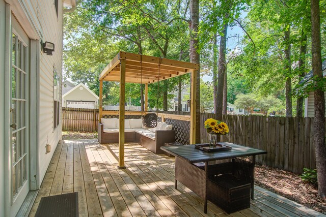 2916 Shadow Ln, North Charleston, SC 29406 - wooden terrace with an outdoor living space, a fenced backyard, and view of scattered trees