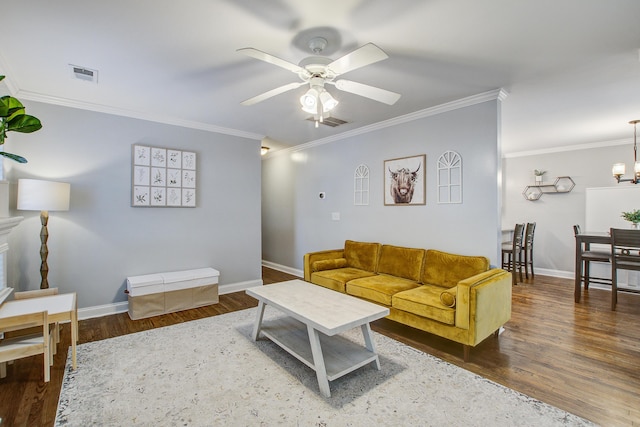 2916 Shadow Ln, North Charleston, SC 29406 - living room featuring ceiling fan, wood finished floors, crown molding, baseboards, and a chandelier
