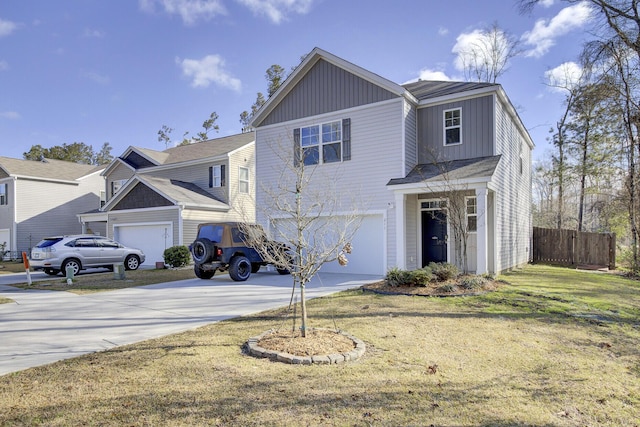 traditional-style home with a garage, concrete driveway, fence, and a front lawn