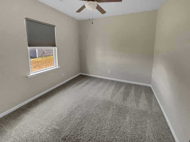 unfurnished room with baseboards, carpet floors, and ceiling fan