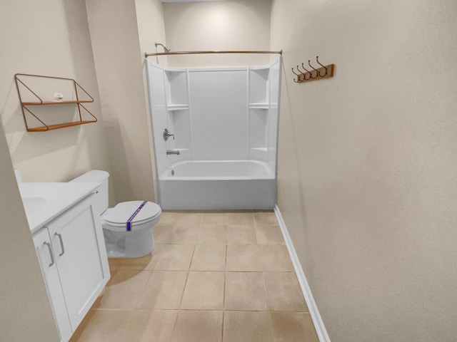 bathroom with toilet, vanity, tile patterned flooring, baseboards, and shower / bathtub combination