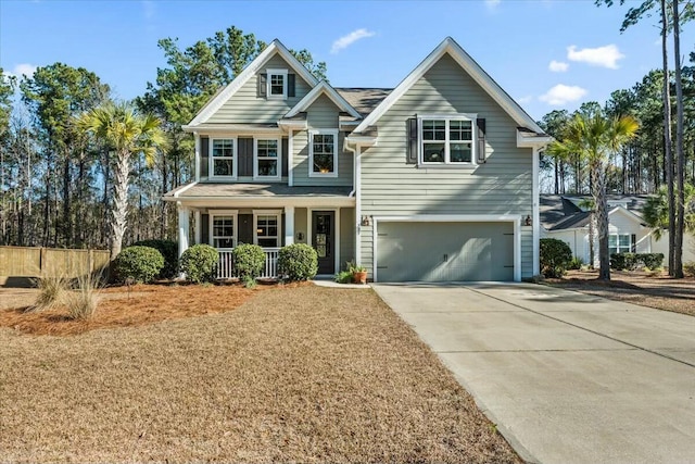 view of front facade featuring a garage and covered porch