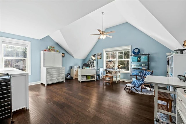 home office with dark wood-type flooring, ceiling fan, lofted ceiling, and a wealth of natural light