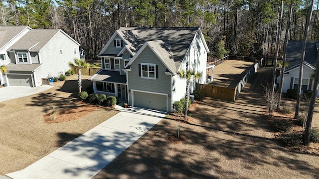 view of front facade featuring a garage and central AC