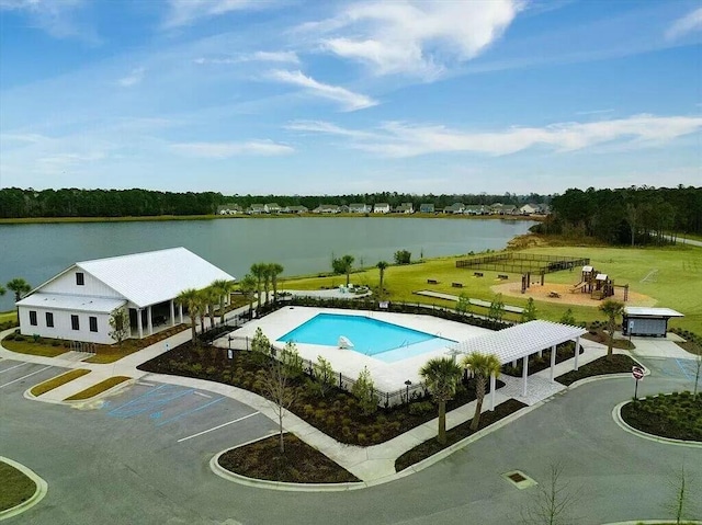 view of pool with a water view