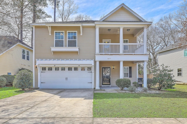 view of front of property featuring driveway, a balcony, an attached garage, a porch, and a front yard