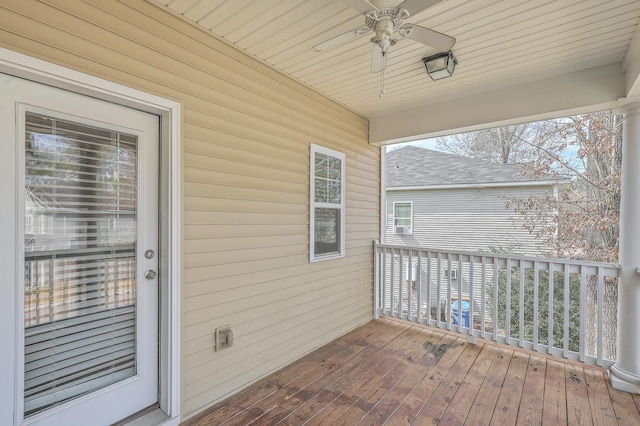 wooden deck featuring ceiling fan