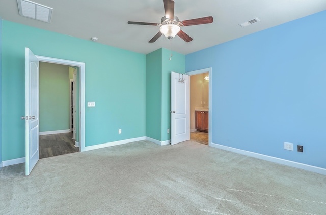 unfurnished bedroom featuring visible vents, ceiling fan, light carpet, and baseboards