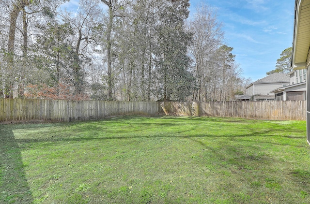 view of yard with a fenced backyard