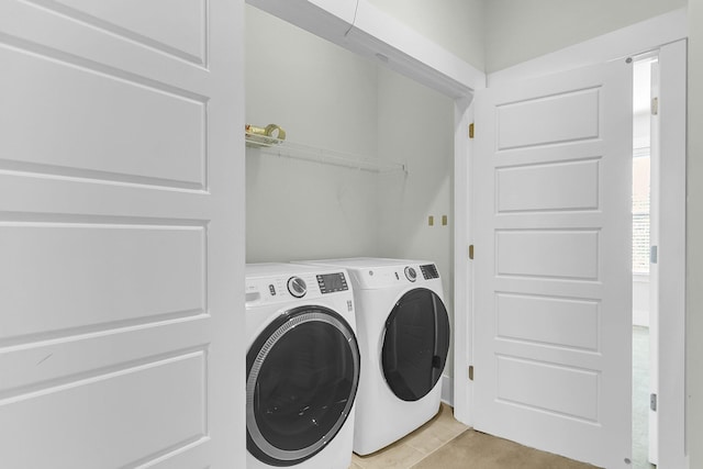 laundry area featuring washing machine and clothes dryer