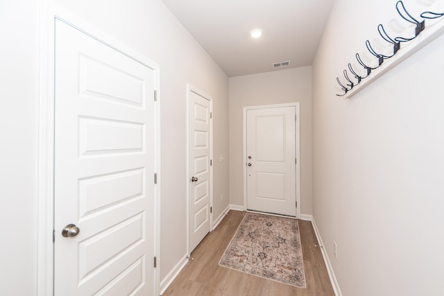 doorway to outside with light hardwood / wood-style flooring