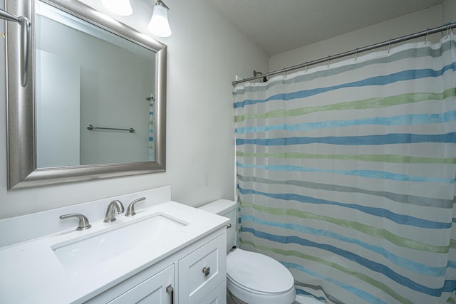 306 Crestview Dr Unit C, Summerville, SC 29485 - full bath featuring toilet, vanity, a textured ceiling, and a shower with shower curtain