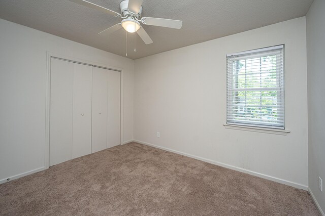 306 Crestview Dr Unit C, Summerville, SC 29485 - unfurnished bedroom featuring carpet flooring, a closet, ceiling fan, and baseboards