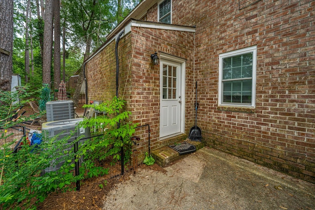 306 Crestview Dr Unit C, Summerville, SC 29485 - property entrance with brick siding, cooling unit, and a patio