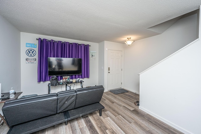 306 Crestview Dr Unit C, Summerville, SC 29485 - living room with wood finished floors, baseboards, and a textured ceiling