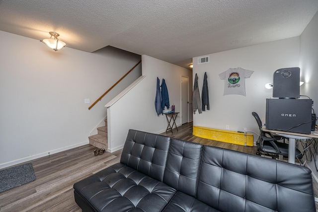 306 Crestview Dr Unit C, Summerville, SC 29485 - living area with wood finished floors, stairs, a textured ceiling, an office area, and baseboards