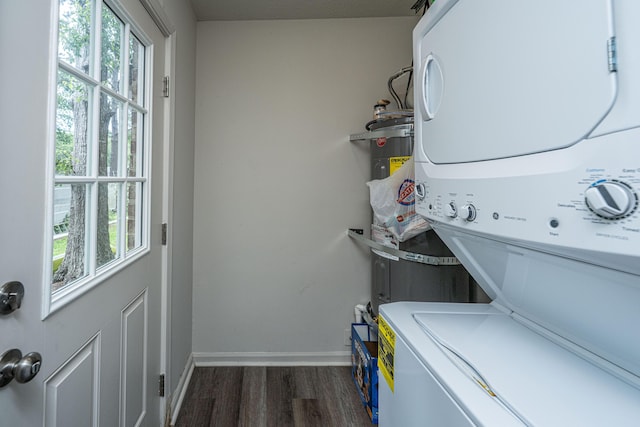 306 Crestview Dr Unit C, Summerville, SC 29485 - laundry room with stacked washer and clothes dryer, dark wood-style flooring, healthy amount of natural light, and baseboards