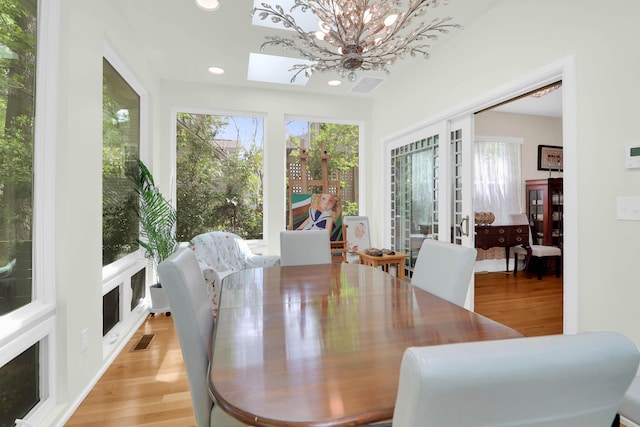 dining room featuring french doors, visible vents, light wood finished floors, and recessed lighting