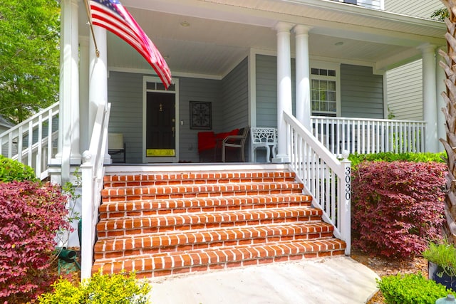 doorway to property featuring covered porch