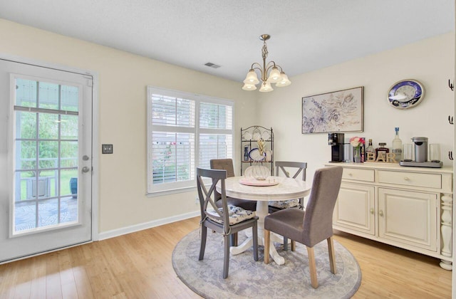 104 Lancaster Ct, Goose Creek, SC 29445 - dining room featuring a chandelier and light wood-style floors