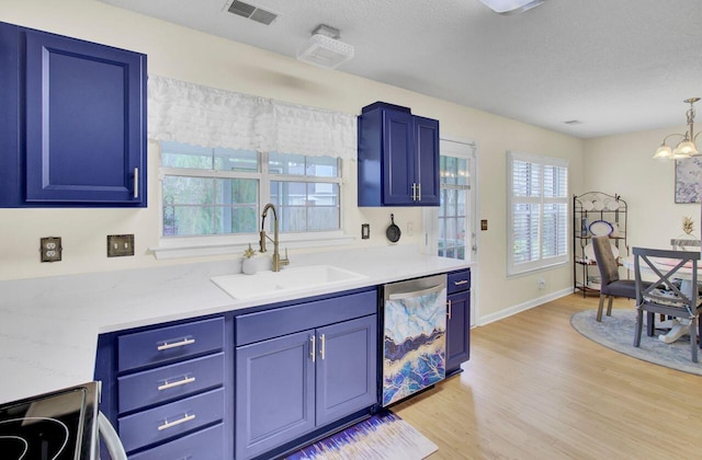104 Lancaster Ct, Goose Creek, SC 29445 - kitchen with stainless steel dishwasher, blue cabinetry, light countertops, light wood finished floors, and a textured ceiling