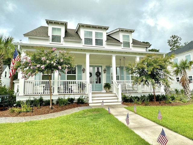 view of front of house featuring a front yard and a porch