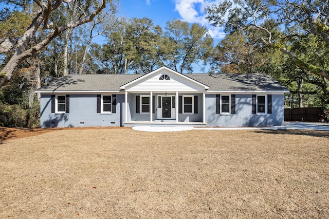 single story home featuring a front lawn